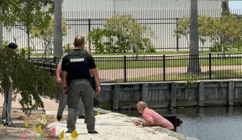 Pursuit ends with man jumping into retention pond