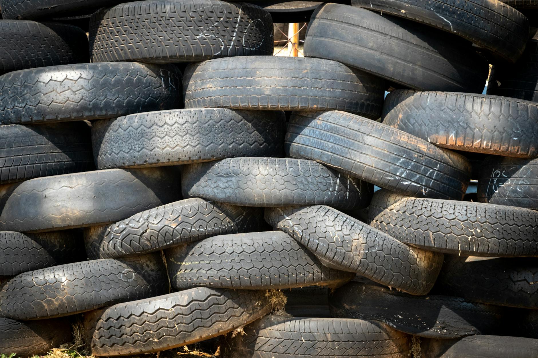 stacked vehicle tire lot mosquitoes