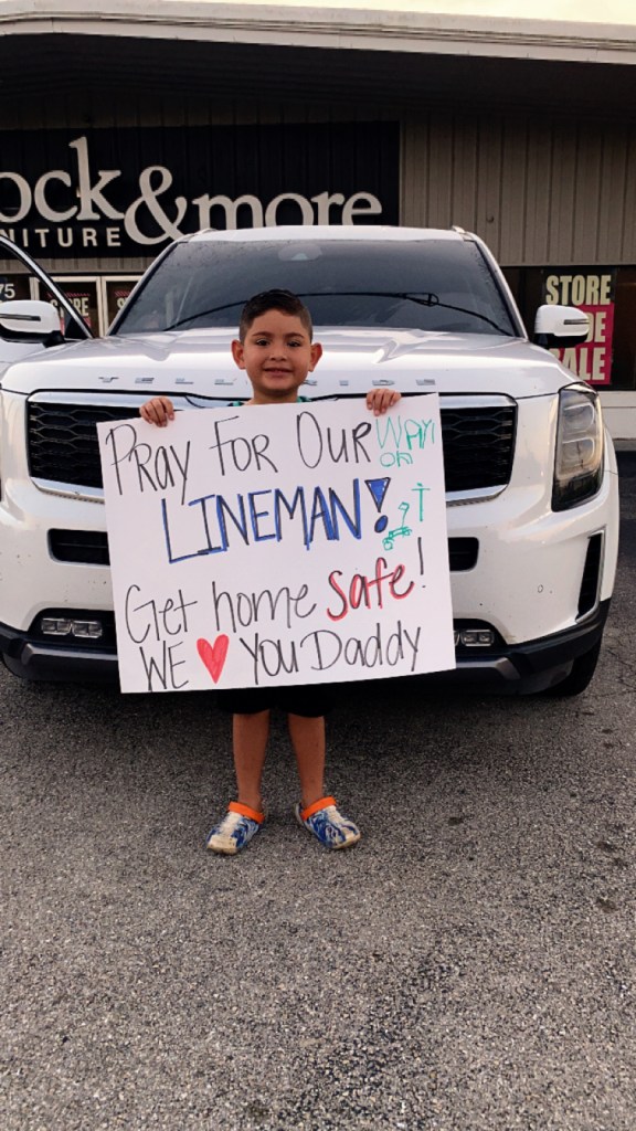 Labelle boy waves his dad who is a lineman off as he heads North. (credit; Heather Thomas)