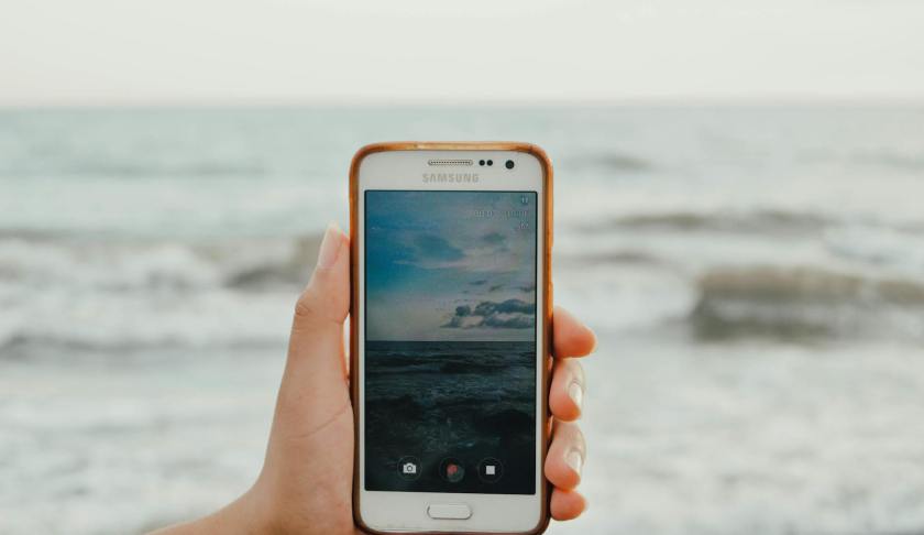 person holding white samsung android smartphone