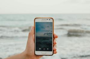 person holding white samsung android smartphone